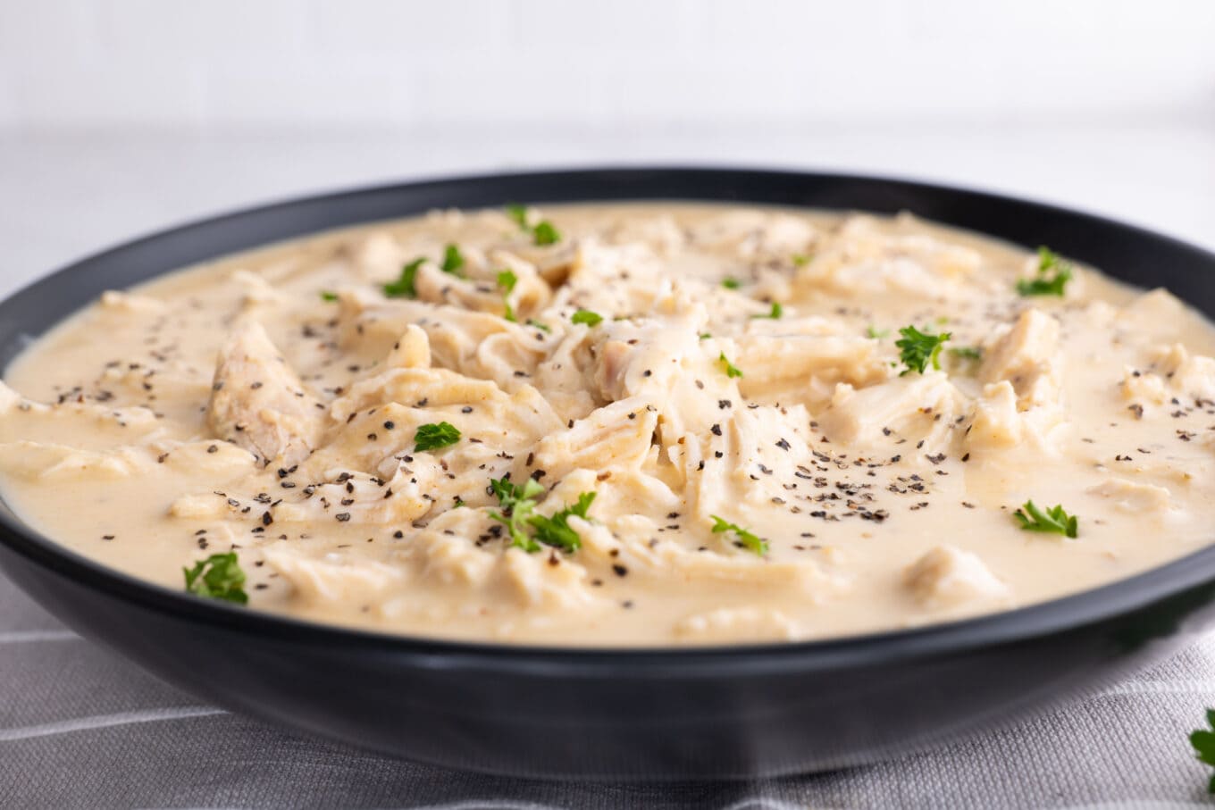 bowl of Slow Cooker Chicken and Gravy side view 