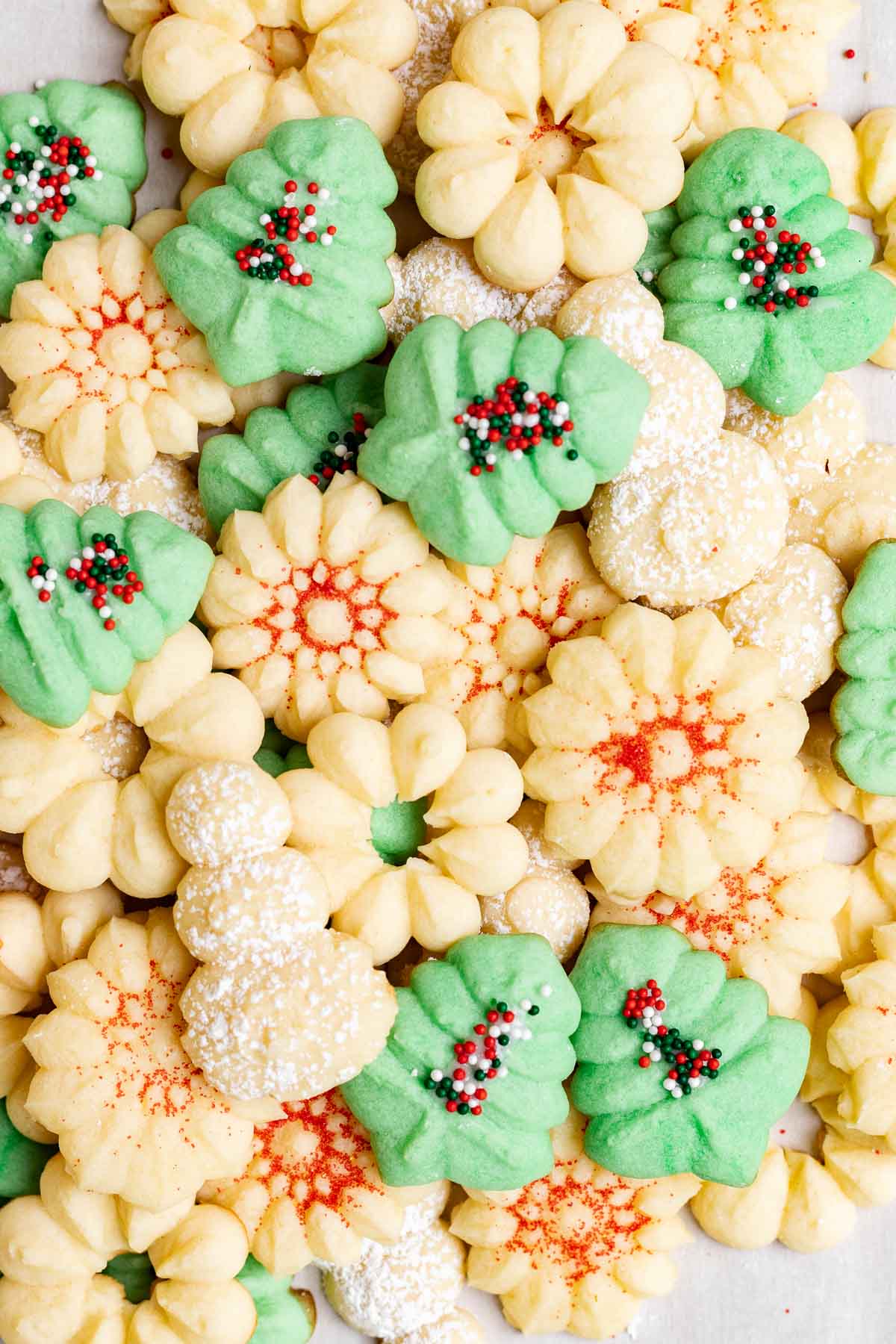 Spritz Cookies with holiday sprinkles on tray