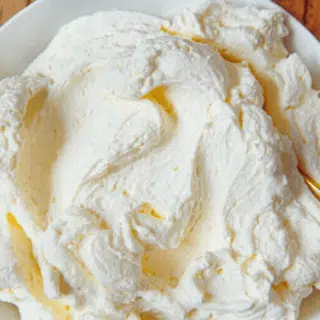 Cream in bowl with spoon