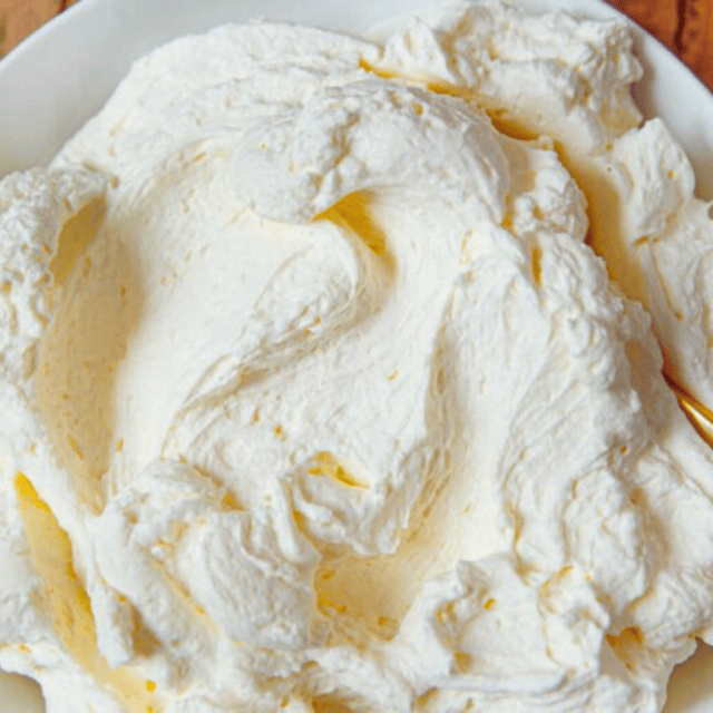 Cream in bowl with spoon