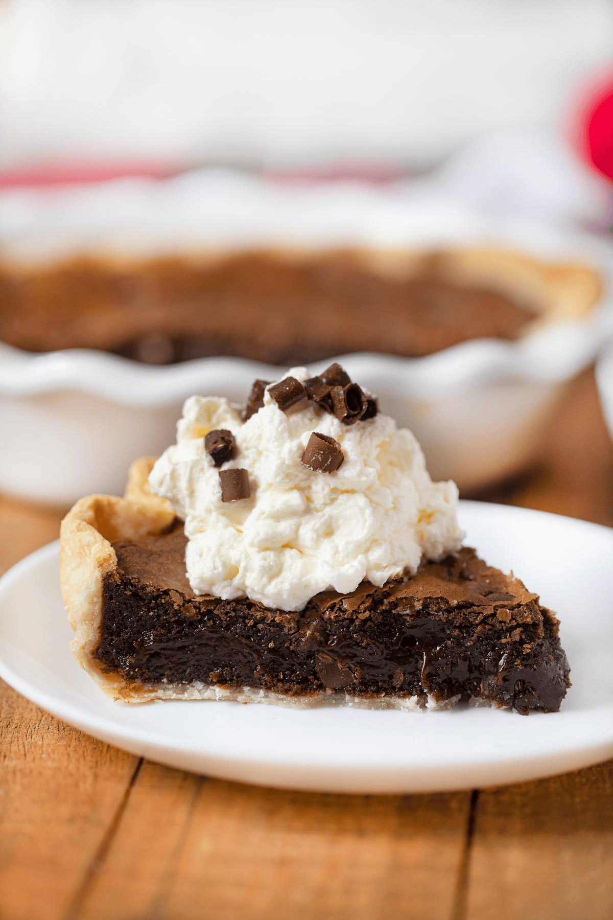 Slice of pie with pie plate in the background
