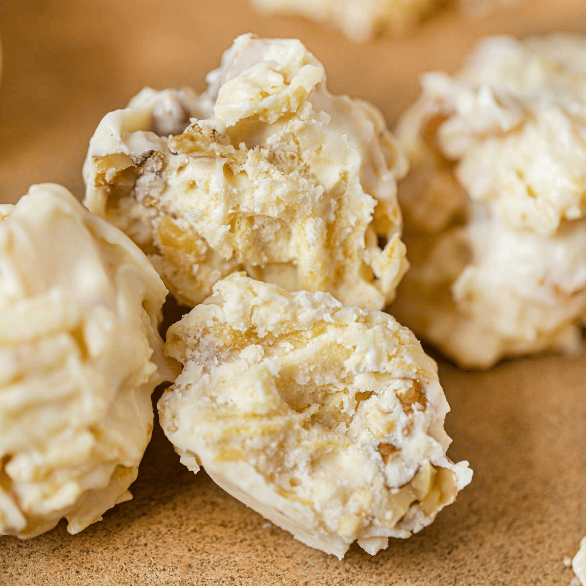 Potato and white chocolate clusters broken in half