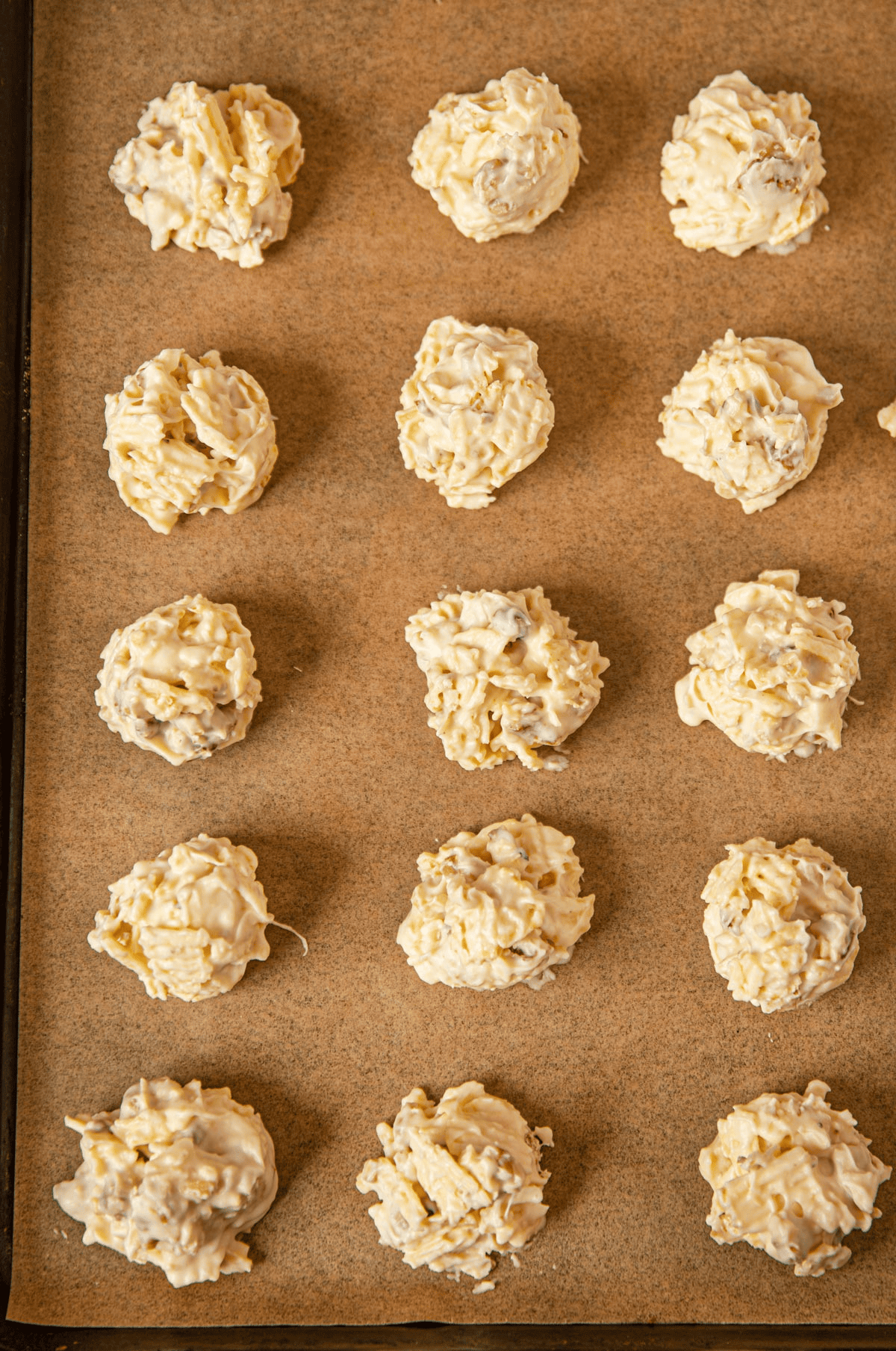 Potato clusters on a parchment-lined baking sheet