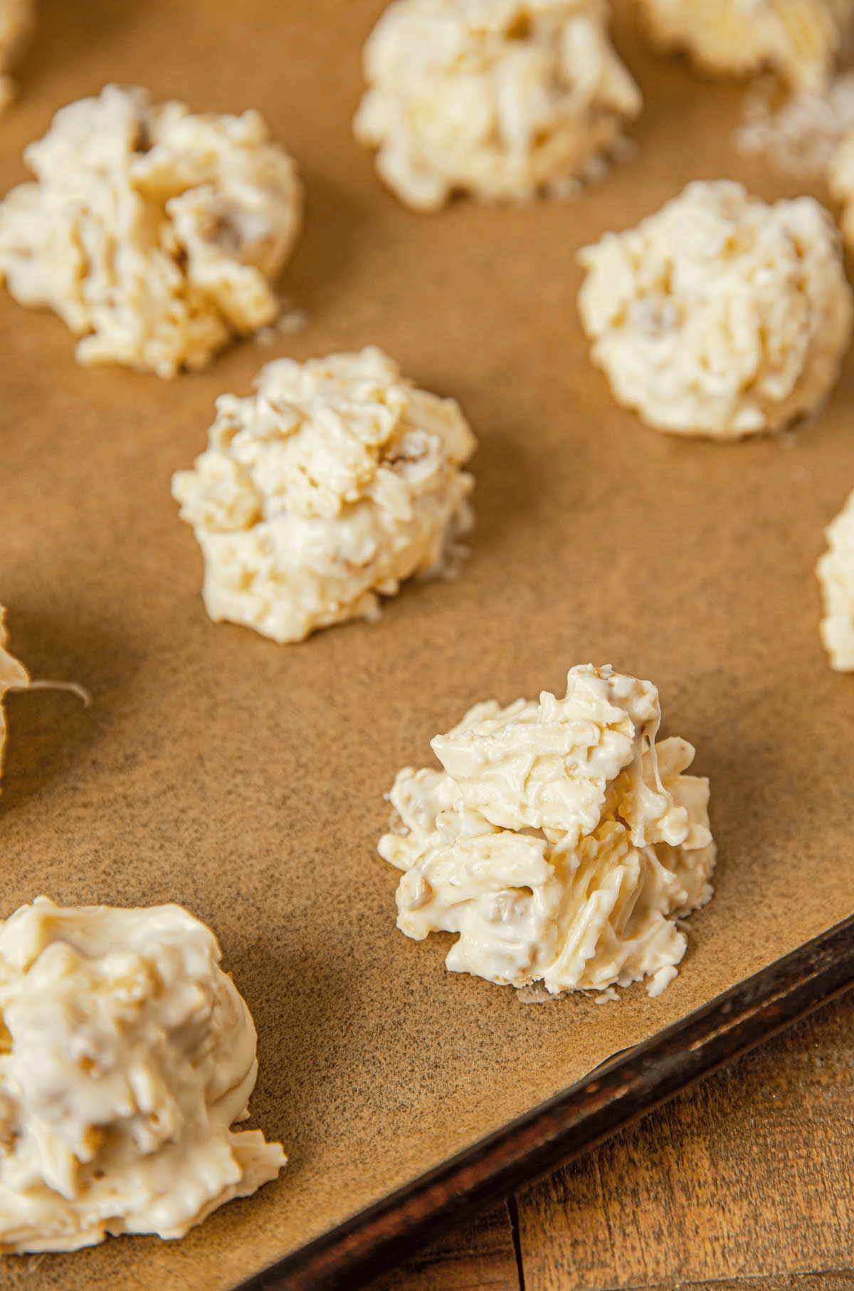 white chocolate clusters on a baking sheet
