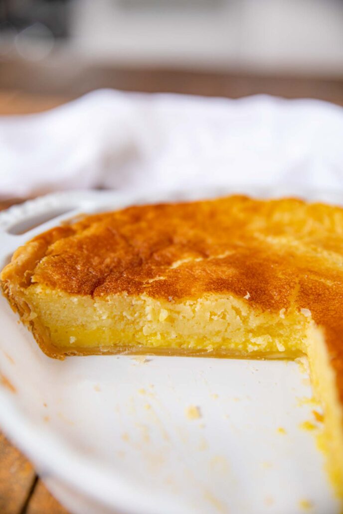 Buttermilk Pie on pie plate with slice removed