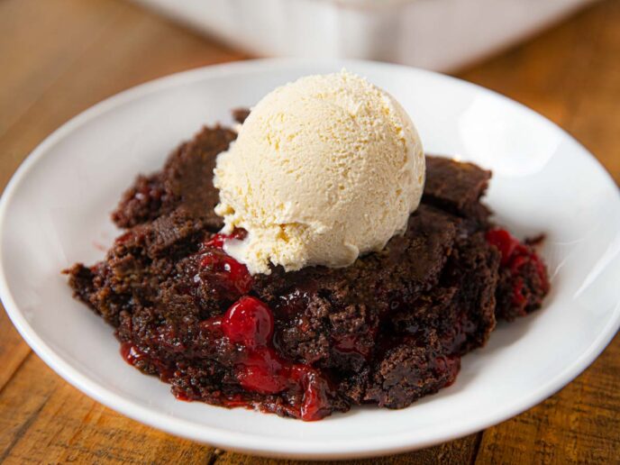 Cherry Chocolate Dump Cake on plate with vanilla ice cream