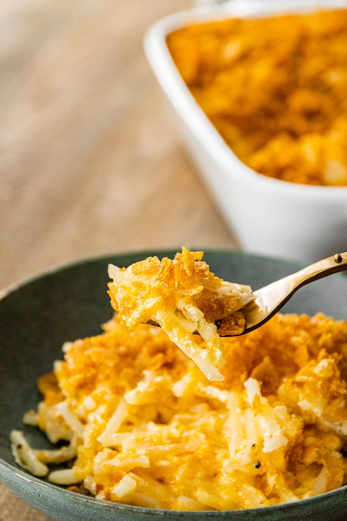 Funeral Potatoes in bowl with fork