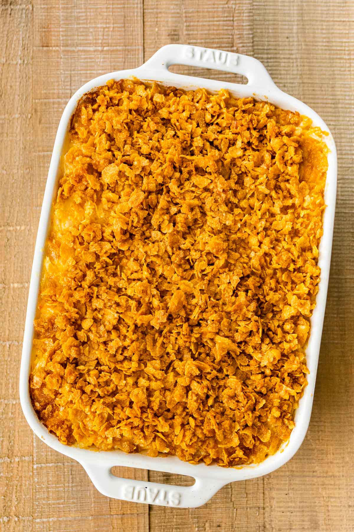 Funeral Potatoes assembled in baking dish with topping after baking