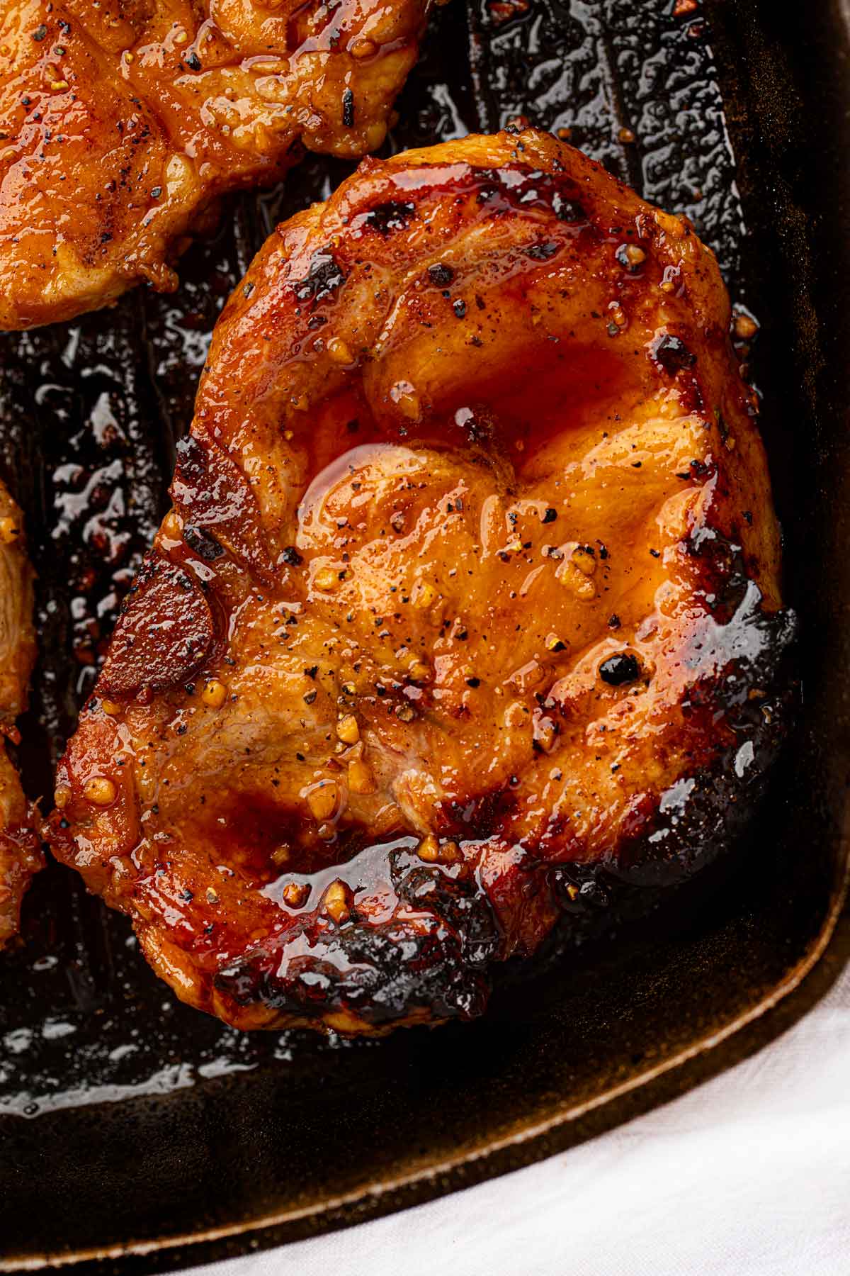 Grilled Pork Chops close up on grill pan