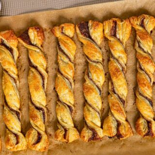 Baked twists lined up on baking sheet.