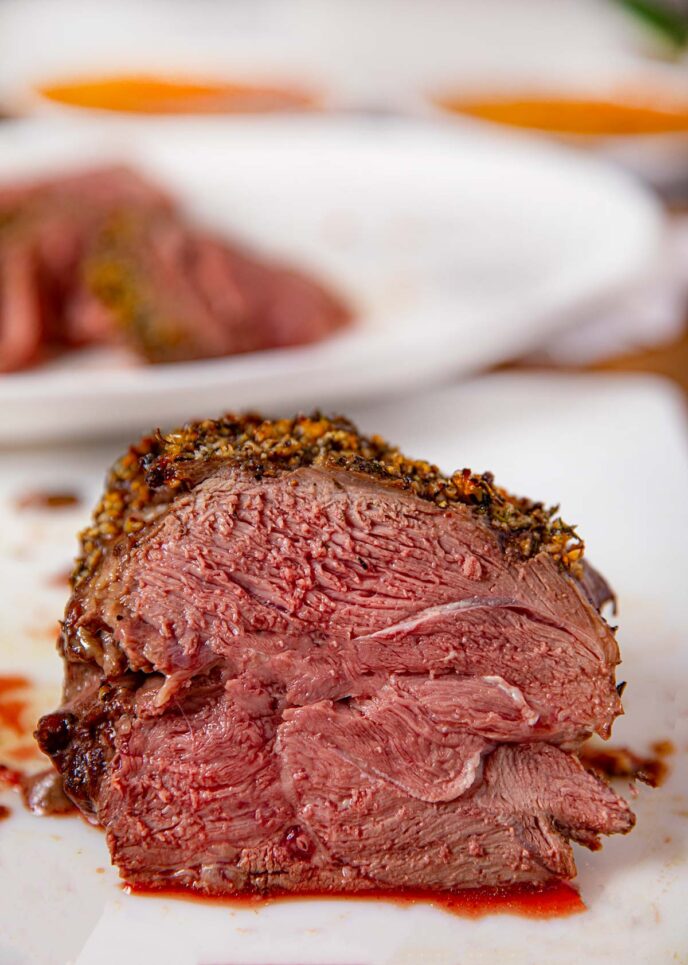 Roast Leg of Lamb sliced on cutting board