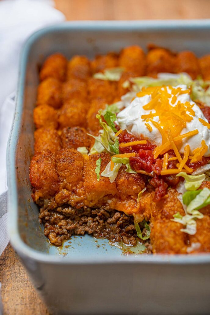 Cheesy Taco Tater Tor Casserole cross section in baking dish