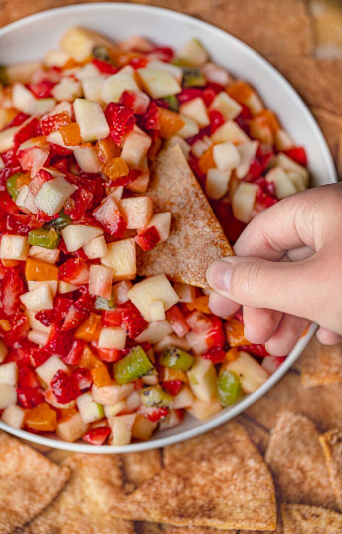 Fruit Salsa with cinnamon chips top-down with chip scooping