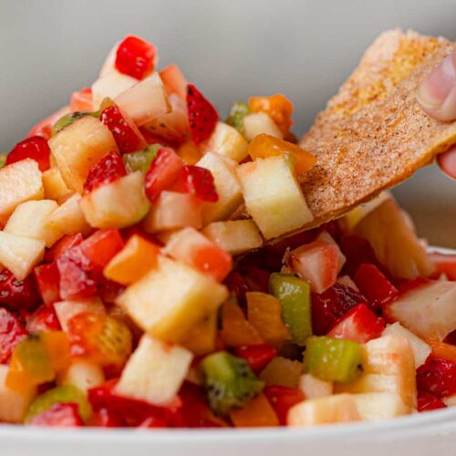 Fruit Salsa in bowl with cinnamon chip dipping