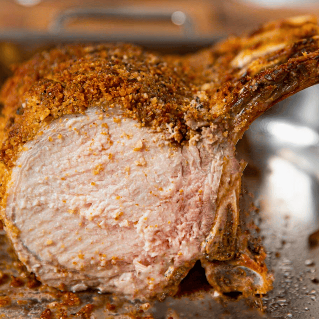 cooked pig meat on baking sheet