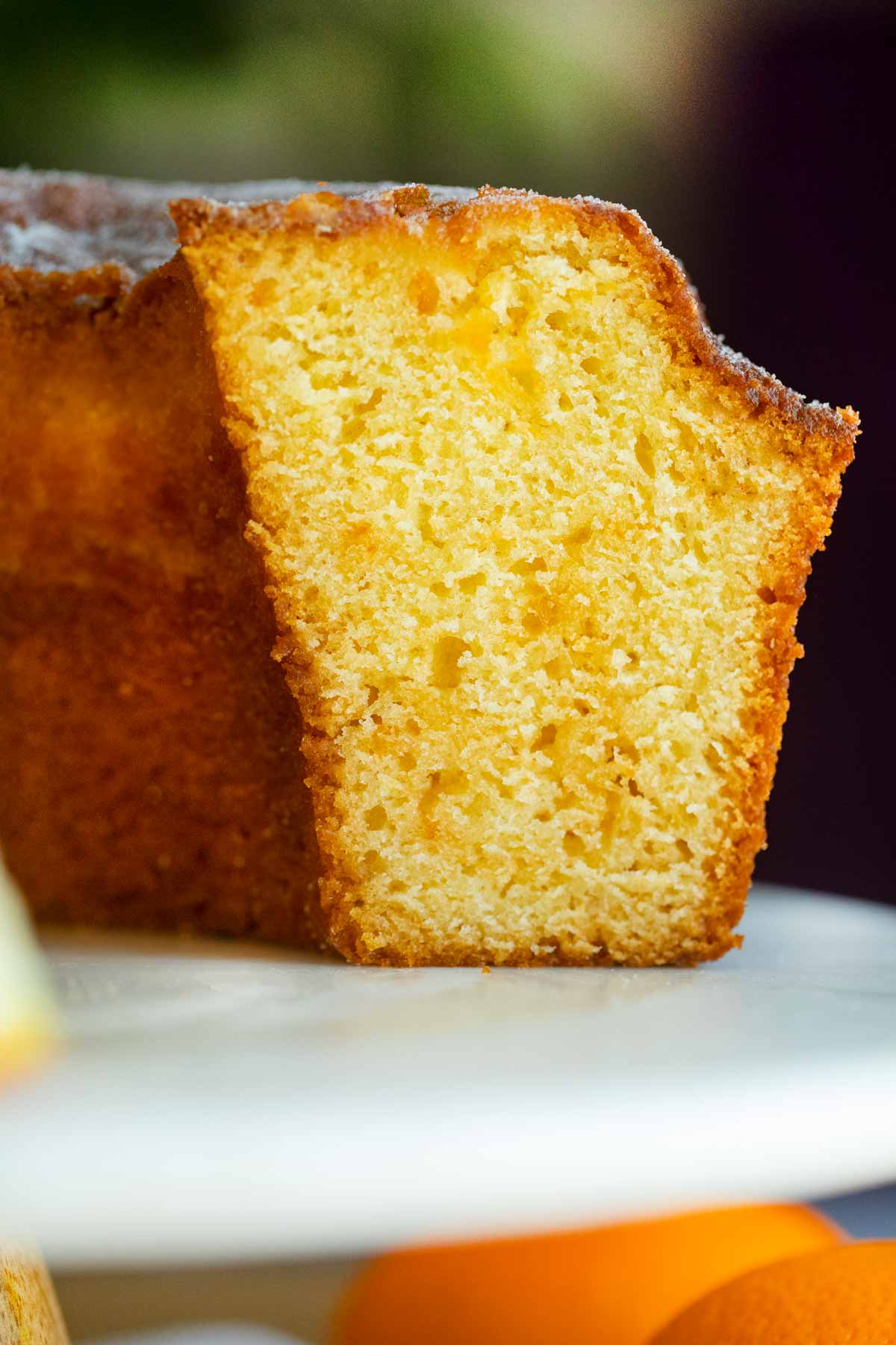 Orange Bundt Cake on cake stand, sliced