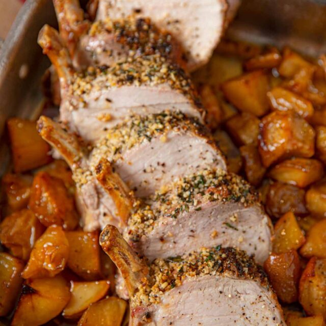 Roasted Rack of Pork individual chops on a bed of roasted potatoes