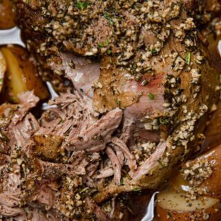 close up of Leg of Lamb with potatoes in a Slow cooker