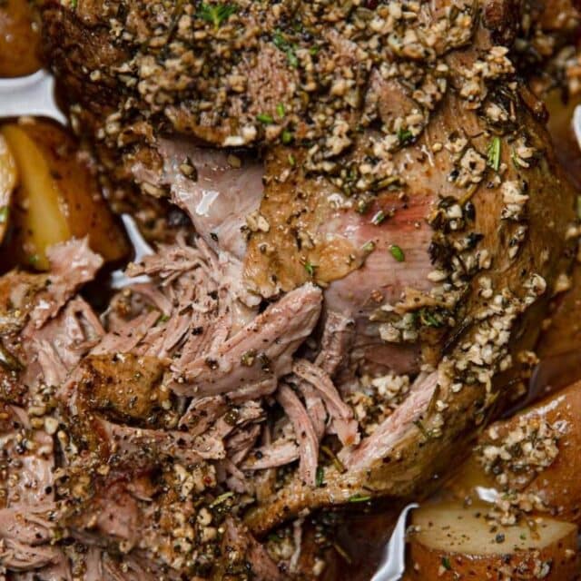 close up of Leg of Lamb with potatoes in a Slow cooker