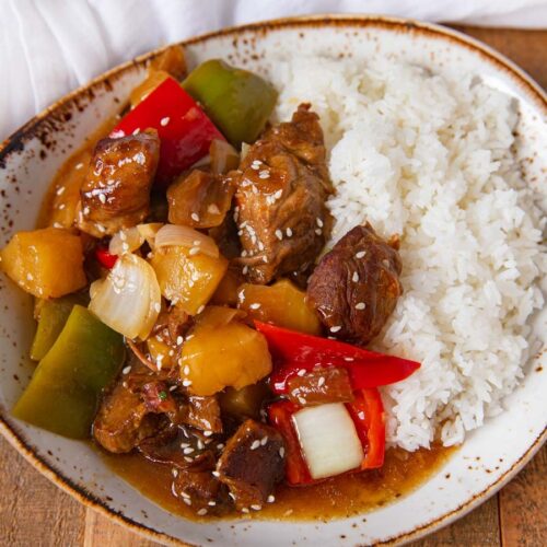 Sweet and Sour Pork in a bowl with white rice.