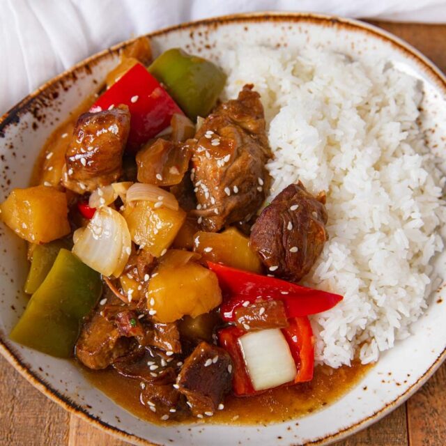 Sweet and Sour Pork in a bowl with white rice.