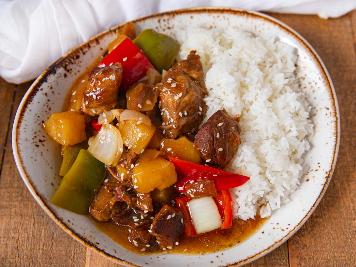 Slow Cooker Sweet and Sour Pork on plate with rice