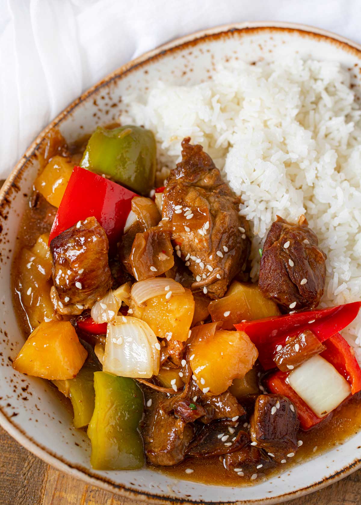 Slow Cooker Sweet and Sour Pork on plate with rice