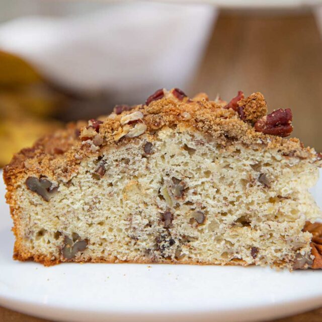 Slice of coffee cake on small white plate