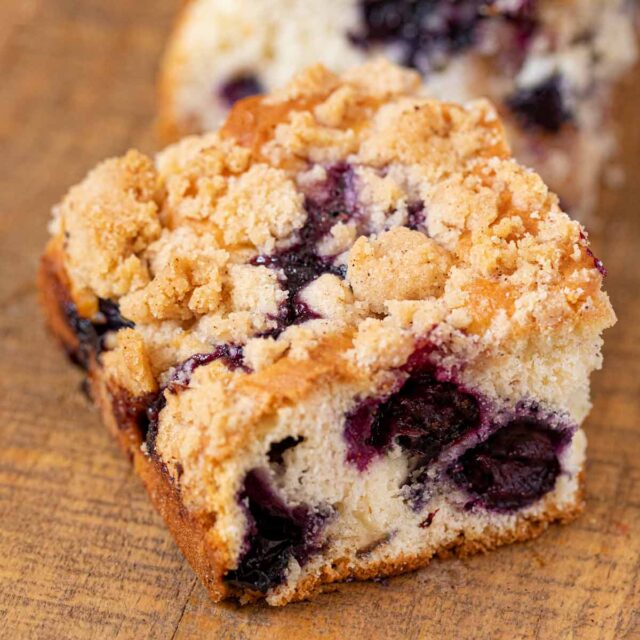 Piece of Blueberry Crumble on wooden board