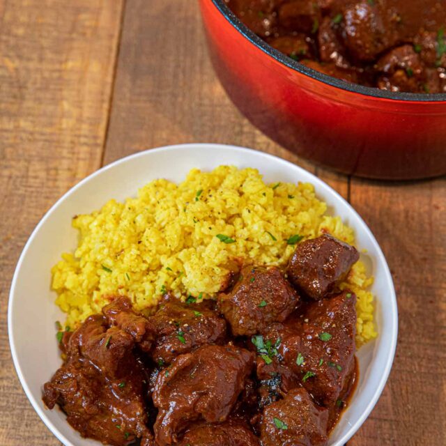 Chile Beef Colorado in bowl with yellow rice
