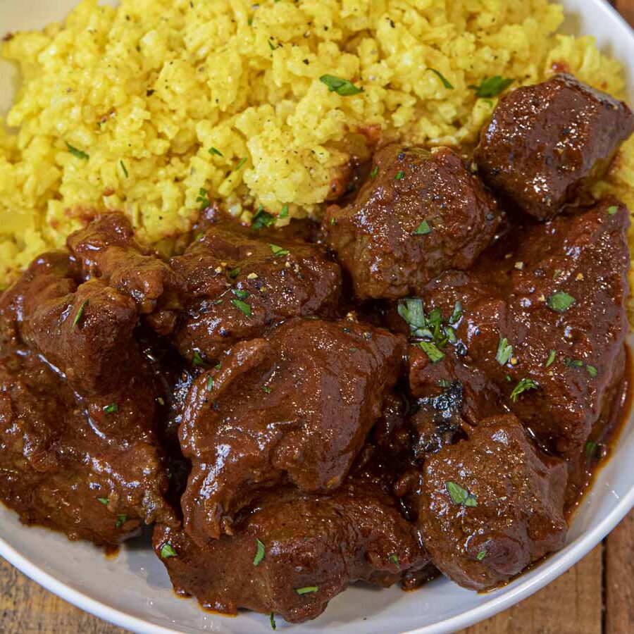 Chile Beef Colorado in bowl with yellow rice