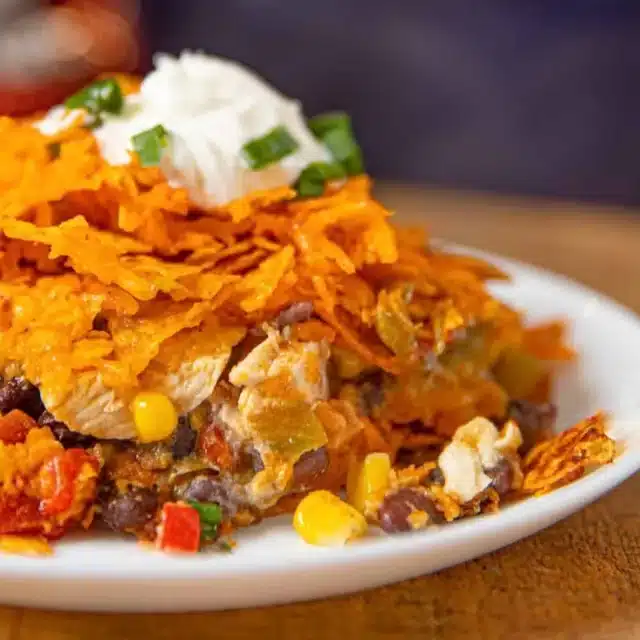 plated casserole topped with sour cream
