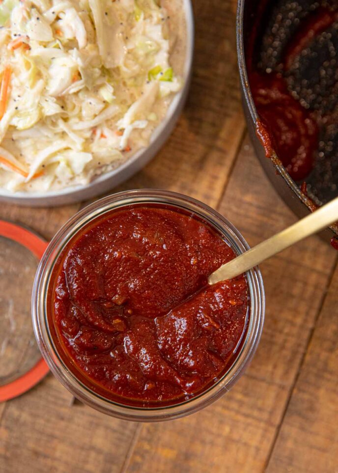 Memphis BBQ Sauce in glass jar with spoon