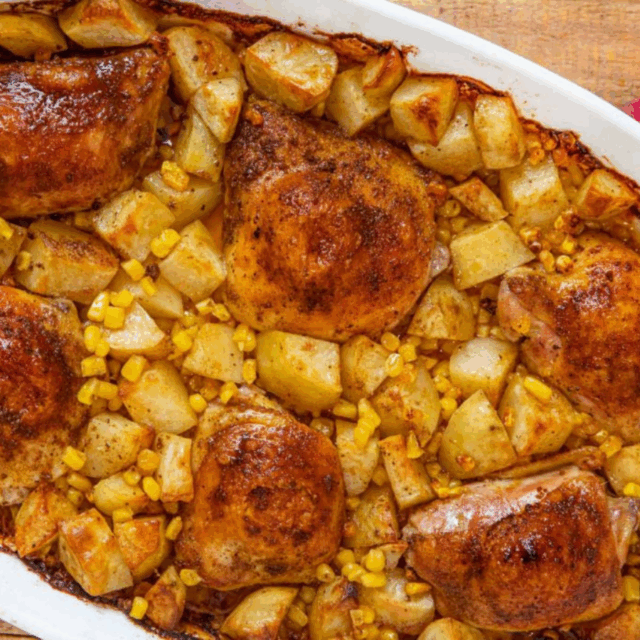 Chicken, potatoes and corn in a baking dish
