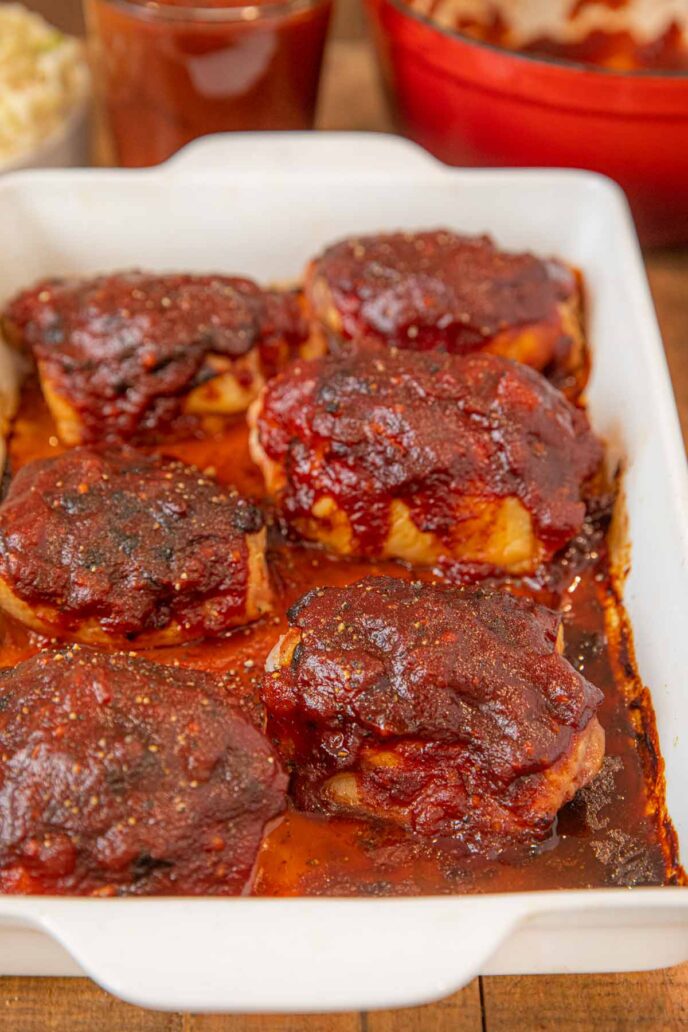 Oven Baked BBQ Chicken Thighs in white baking dish