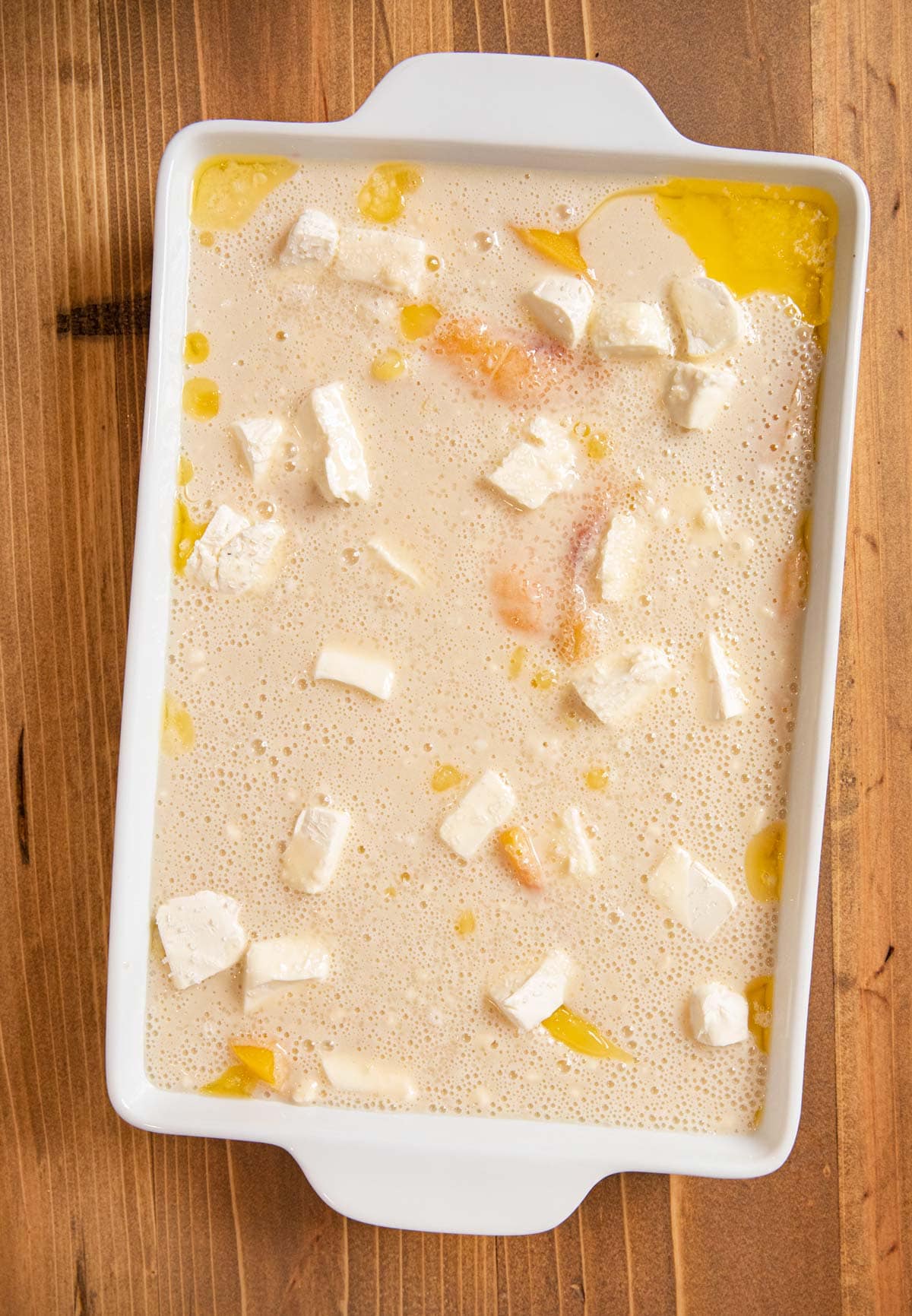 Peaches and Cream Cobbler in baking dish before baking