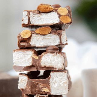 Rocky road chocolate bar cut in pieces and stacked on top of each other