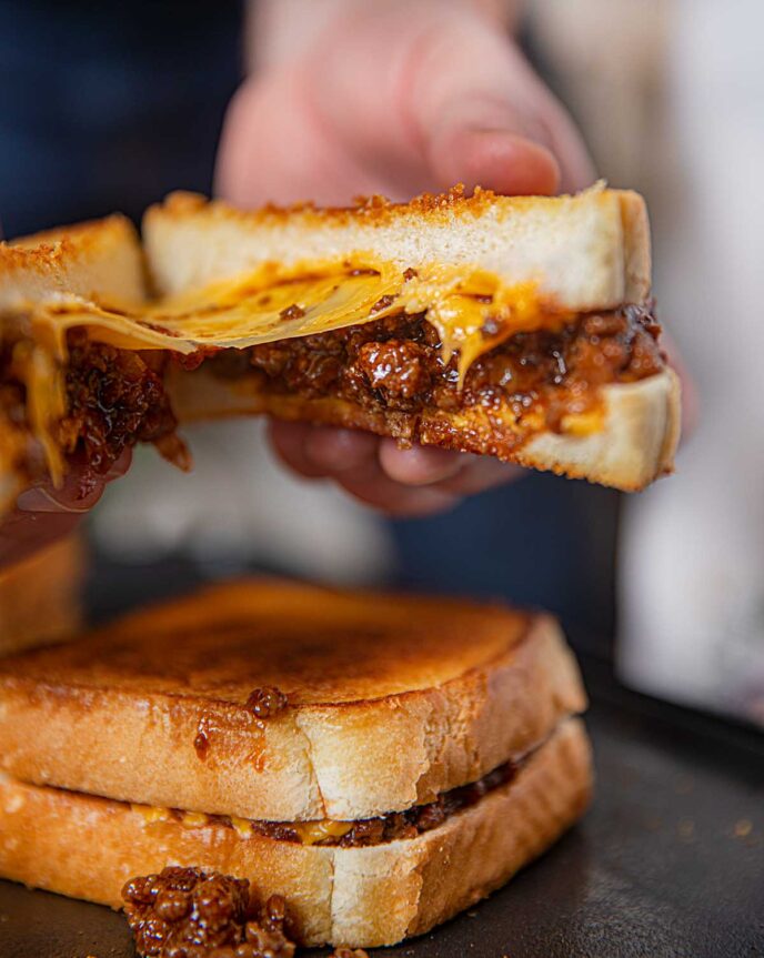 Sloppy Joe Grilled Cheese being pulled apart