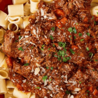 beef and tomato sauce mixture on top of pasta noodles