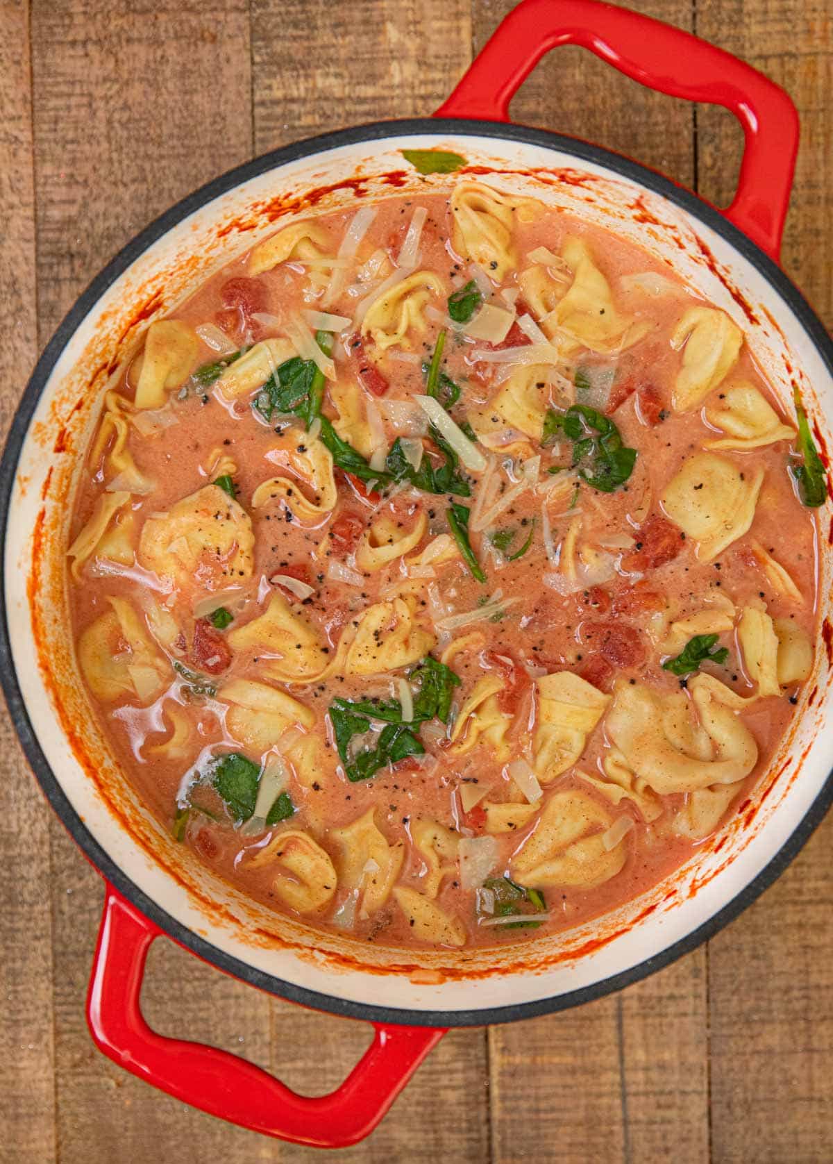 Creamy Tomato Tortellini Soup in red dutch oven