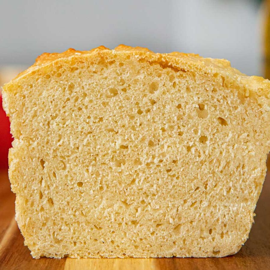 Beer Bread sliced loaf on cutting board