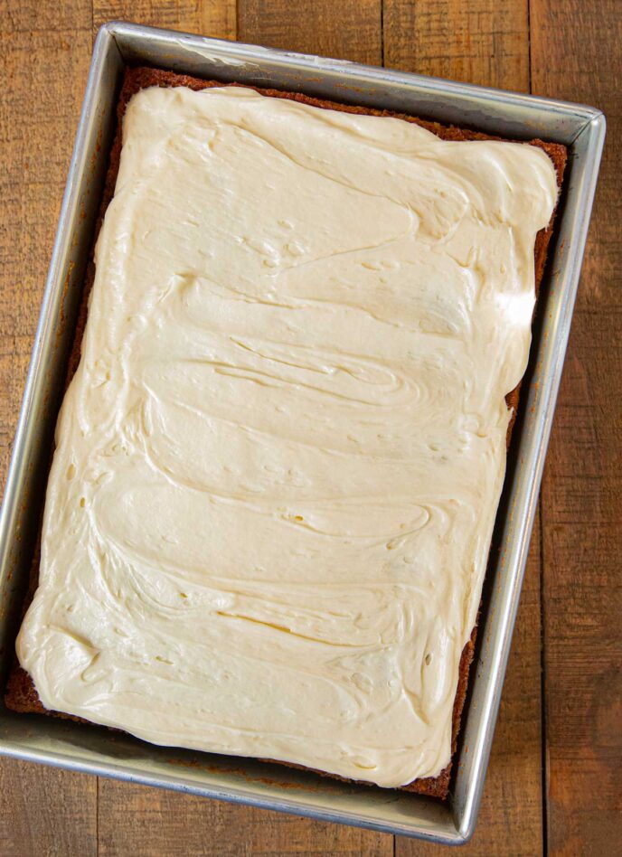 Carrot Sheet Cake with frosting in baking pan