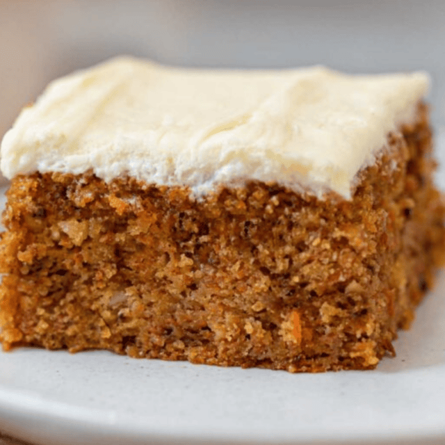 single slice of cake on a plate topped with frosting