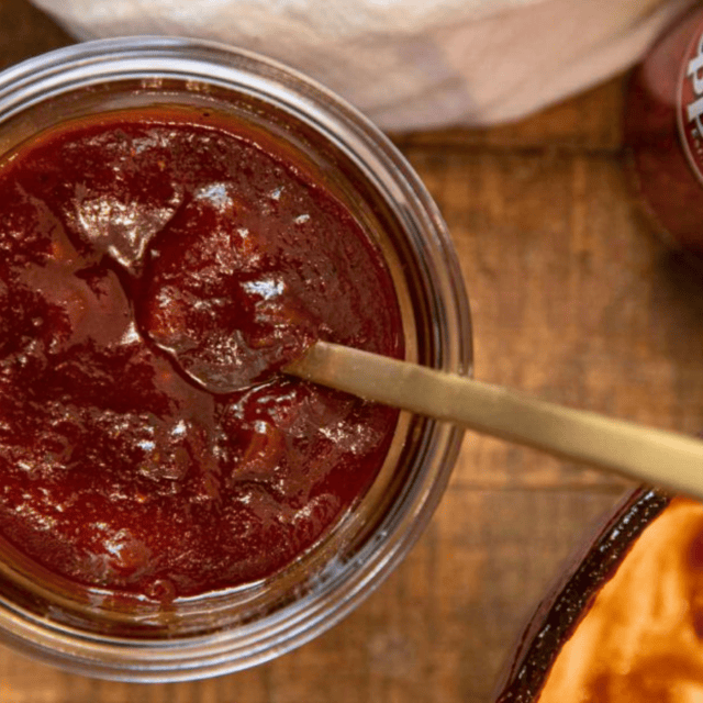jar of sauce with spoon