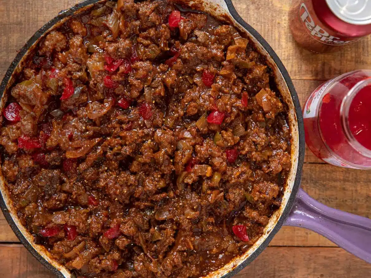 Sloppy Joe mix in pan with ingredients on the side
