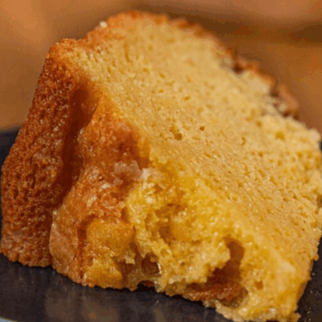 slice of cake on black plate