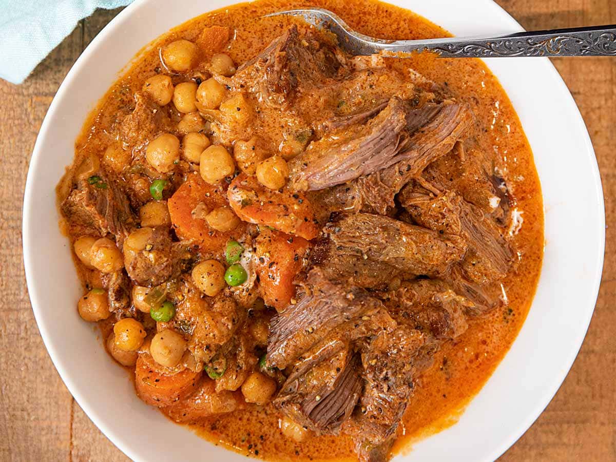 Homemade pot roast with chickpeas, creamy sauce, and vegetables