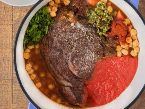 Chuck roast in a Dutch oven with ingredients