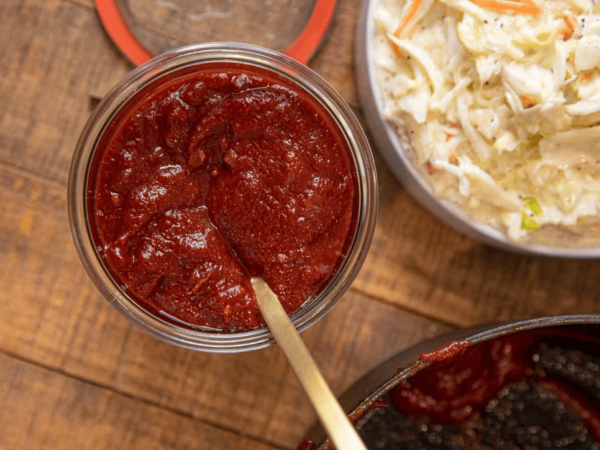top down view of bbq sauce with slaw on the side