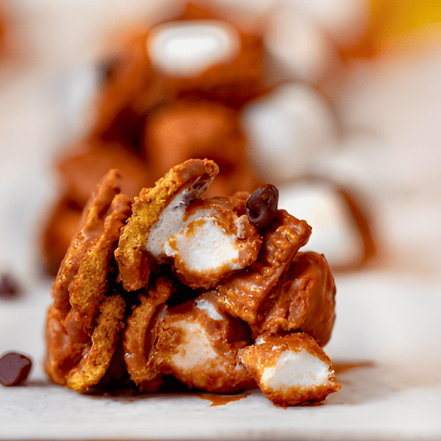 golden cereal squares combined with marshmallow and chocolate bitten in half